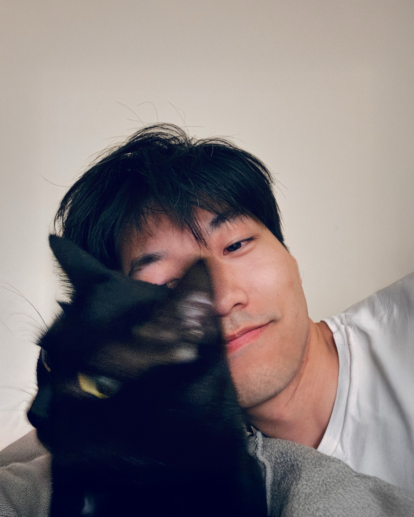 June, cheek to cheek with a black cat